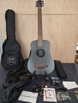 Klos Acoustic Electric Traveler Guitar Limited Edition Orange Carbon Fiber. Fixed Price $1999.00.