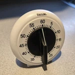 Taylor 5831N Mechanical Kitchen Timer 60-MINUTE Countdown Dial, White/black. Fixed Price $10.00.