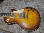 2009 Gibson Les Paul Guitar With Tiger Burst Finish. Fixed Price $2000.00.