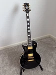 Left Handed 2000 Gibson Les Paul Custom Electric Guitar Black Ebony. Fixed Price $3600.00.