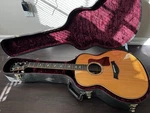 Taylor 818E Grand Orchestra Acoustic/electric Guitar With Hardshell Case. Fixed Price $3100.00.