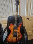B.c. Rich Electric Guitar Orange Solid Body 6 String Quilted Maple Top. Fixed Price $825.00.