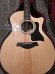 Taylor 314CE Acoustic-electric Guitar With Hard-shell Case. Fixed Price $1400.00.