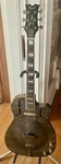 Dean Resonator Thin Body Cutaway Brass Guitar With Palm Trees Graphics. Fixed Price $795.00.